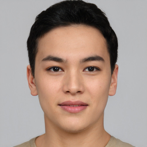 Joyful asian young-adult male with short  black hair and brown eyes