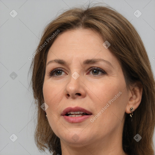 Joyful white adult female with medium  brown hair and brown eyes