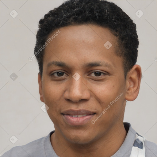 Joyful black young-adult male with short  black hair and brown eyes