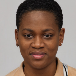 Joyful black young-adult female with short  brown hair and brown eyes