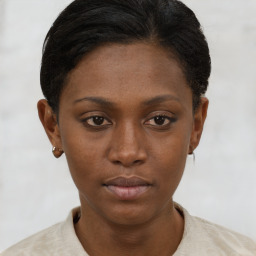 Neutral black young-adult female with short  brown hair and brown eyes