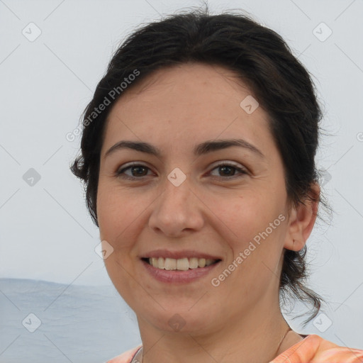 Joyful white adult female with medium  brown hair and brown eyes