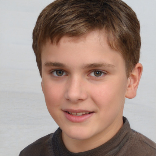 Joyful white child male with short  brown hair and brown eyes