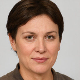 Joyful white adult female with short  brown hair and grey eyes