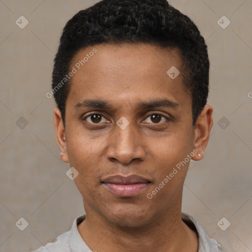 Joyful black young-adult male with short  black hair and brown eyes