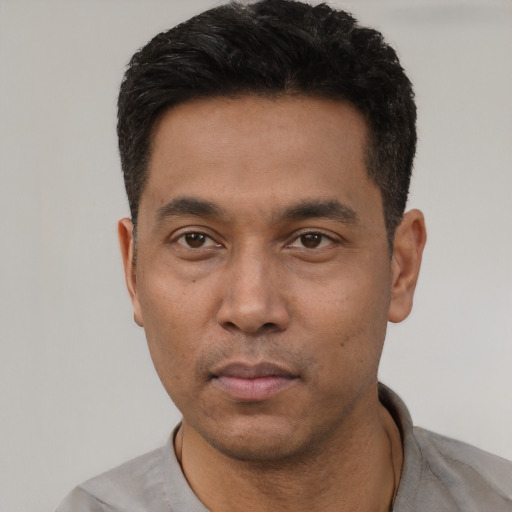 Neutral black young-adult male with short  black hair and brown eyes