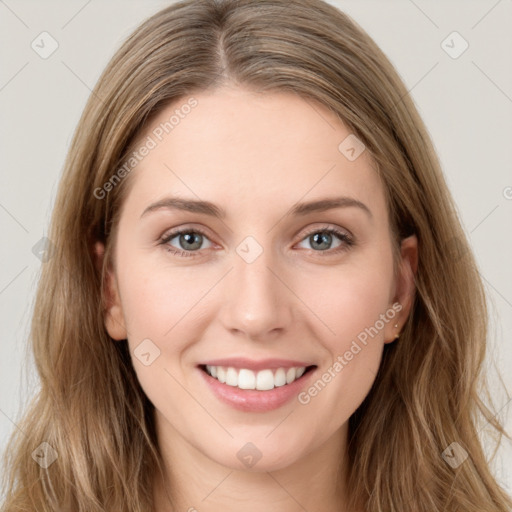 Joyful white young-adult female with long  brown hair and green eyes