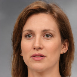 Joyful white adult female with medium  brown hair and brown eyes