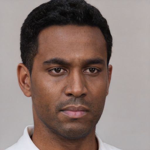 Neutral black young-adult male with short  black hair and brown eyes