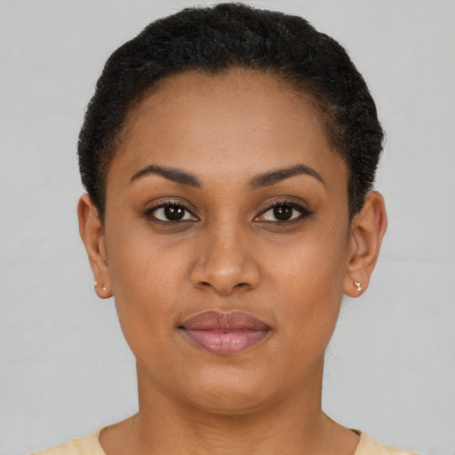 Joyful latino young-adult female with short  brown hair and brown eyes