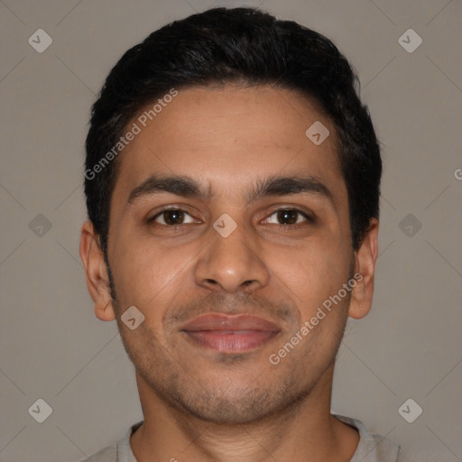 Joyful latino young-adult male with short  black hair and brown eyes