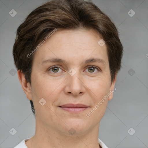 Joyful white adult female with short  brown hair and grey eyes