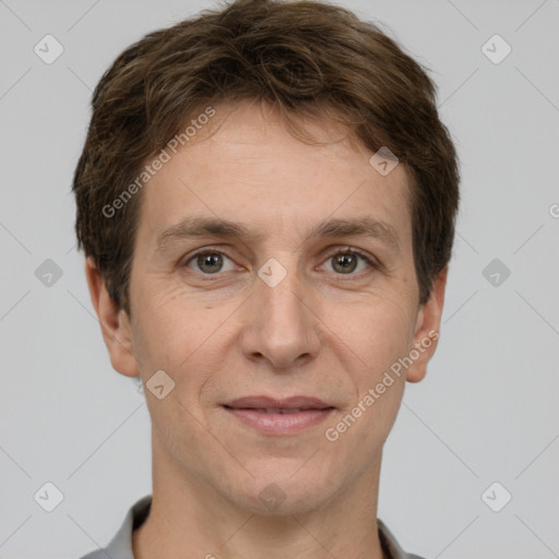 Joyful white adult male with short  brown hair and grey eyes