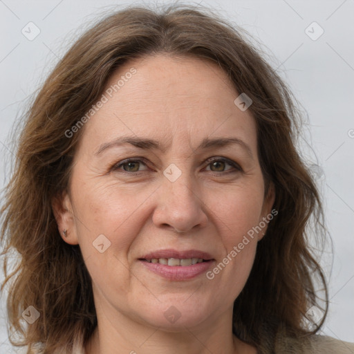 Joyful white adult female with medium  brown hair and grey eyes