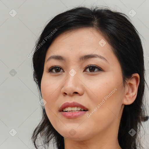 Joyful asian young-adult female with medium  brown hair and brown eyes