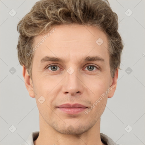 Joyful white adult male with short  brown hair and grey eyes