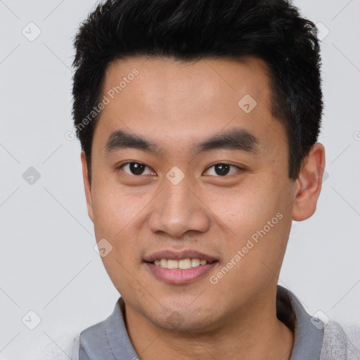 Joyful white young-adult male with short  black hair and brown eyes