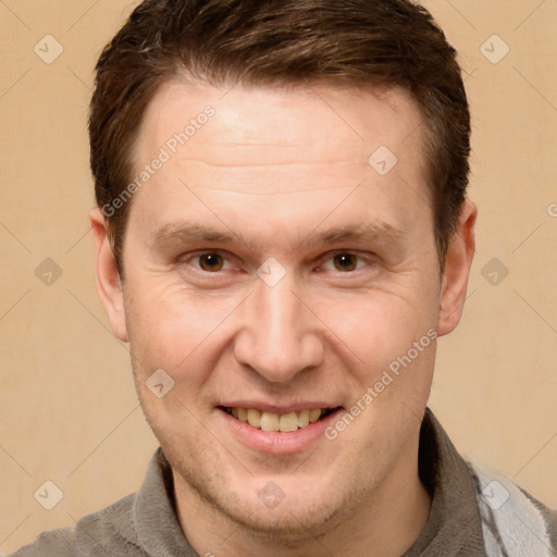 Joyful white adult male with short  brown hair and grey eyes