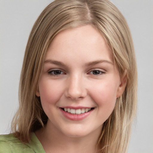 Joyful white young-adult female with medium  brown hair and brown eyes