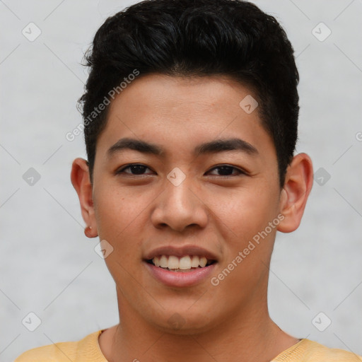 Joyful asian young-adult male with short  brown hair and brown eyes