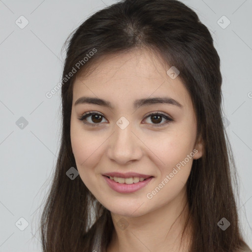 Joyful asian young-adult female with long  brown hair and brown eyes