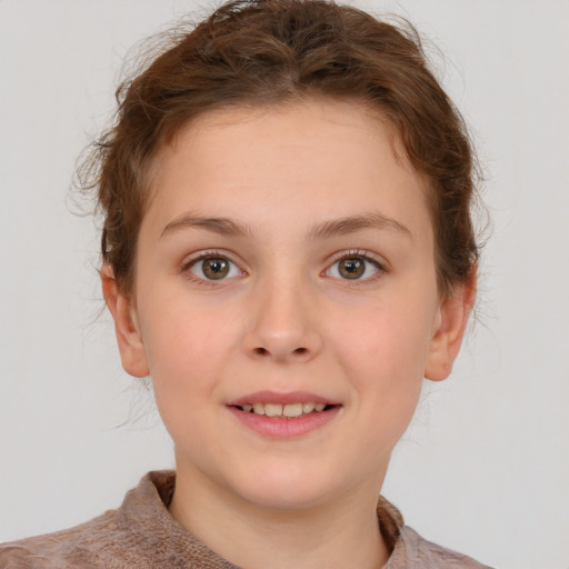 Joyful white child female with short  brown hair and brown eyes