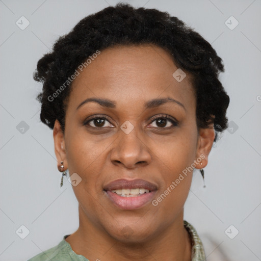 Joyful black adult female with short  brown hair and brown eyes