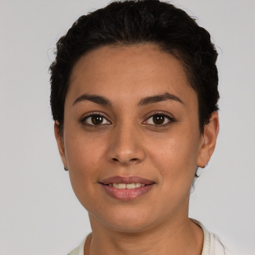 Joyful white young-adult female with short  black hair and brown eyes