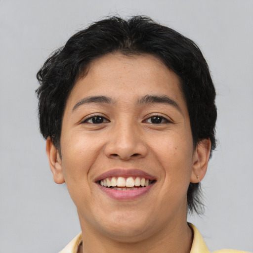 Joyful asian young-adult female with short  brown hair and brown eyes