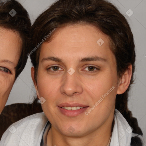 Joyful white adult female with medium  brown hair and brown eyes