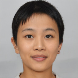 Joyful asian young-adult female with short  brown hair and brown eyes