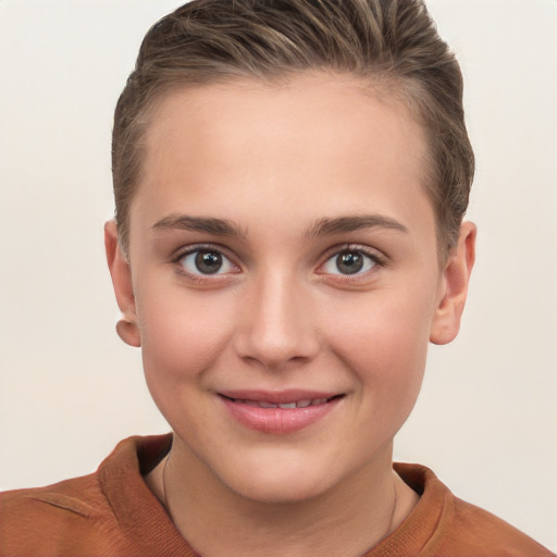 Joyful white young-adult female with short  brown hair and grey eyes