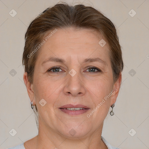 Joyful white adult female with short  brown hair and grey eyes