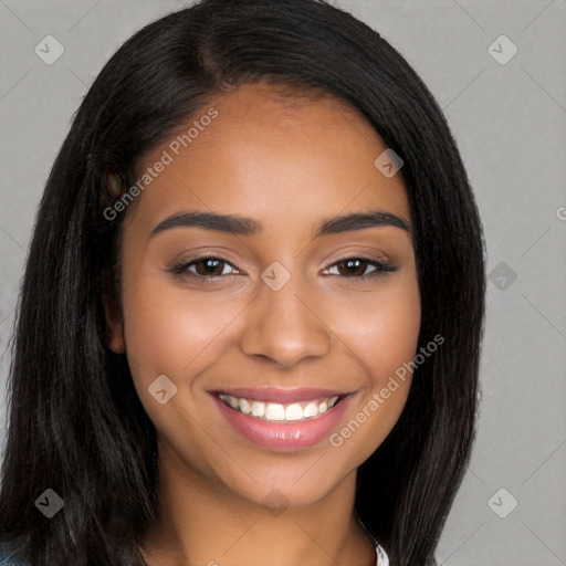 Joyful latino young-adult female with long  black hair and brown eyes