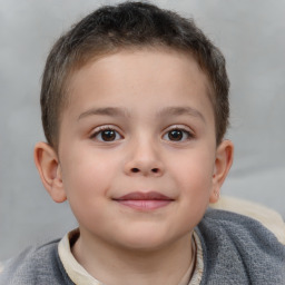 Joyful white child male with short  brown hair and brown eyes