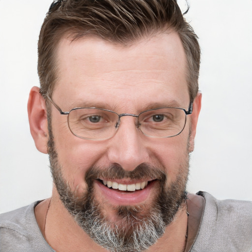 Joyful white adult male with short  brown hair and grey eyes