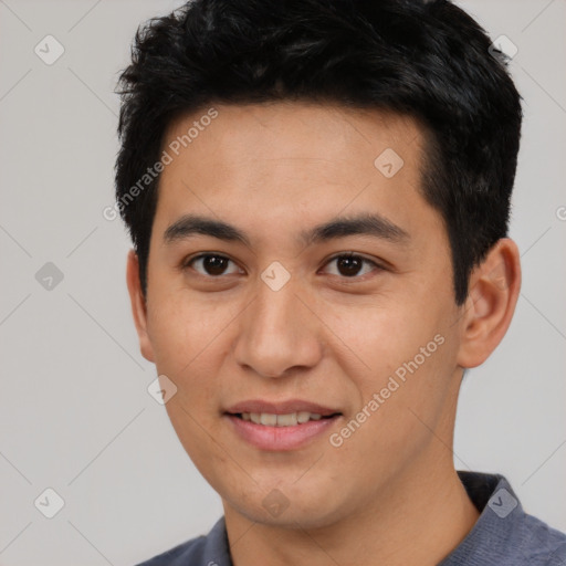 Joyful asian young-adult male with short  black hair and brown eyes