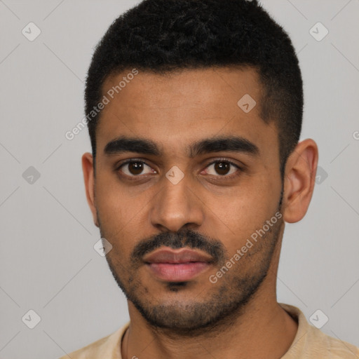 Neutral latino young-adult male with short  black hair and brown eyes