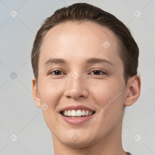 Joyful white young-adult female with short  brown hair and brown eyes