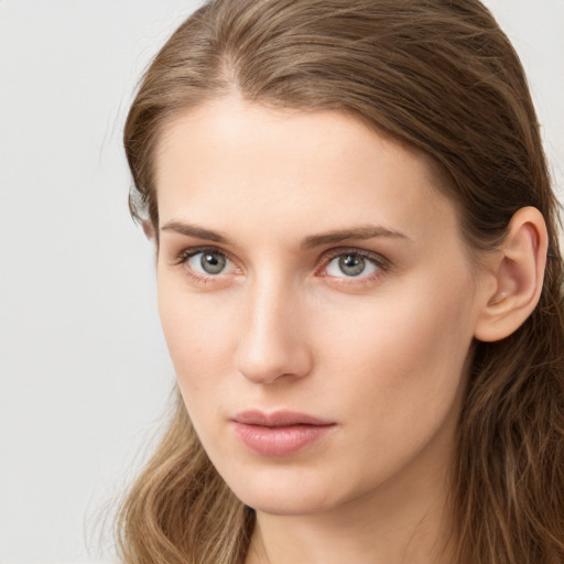 Neutral white young-adult female with long  brown hair and grey eyes