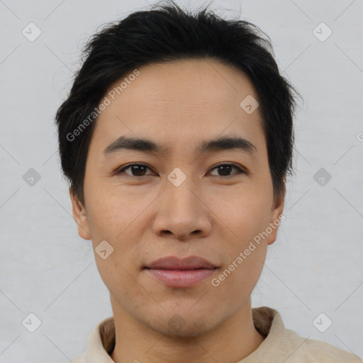 Joyful asian young-adult male with short  brown hair and brown eyes