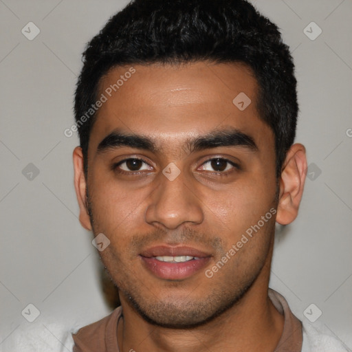 Joyful latino young-adult male with short  brown hair and brown eyes