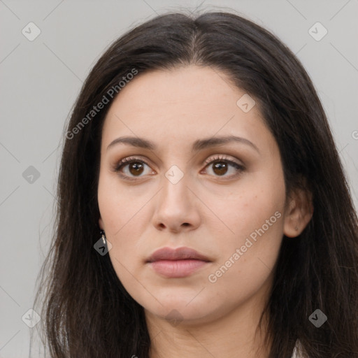 Neutral white young-adult female with long  brown hair and brown eyes