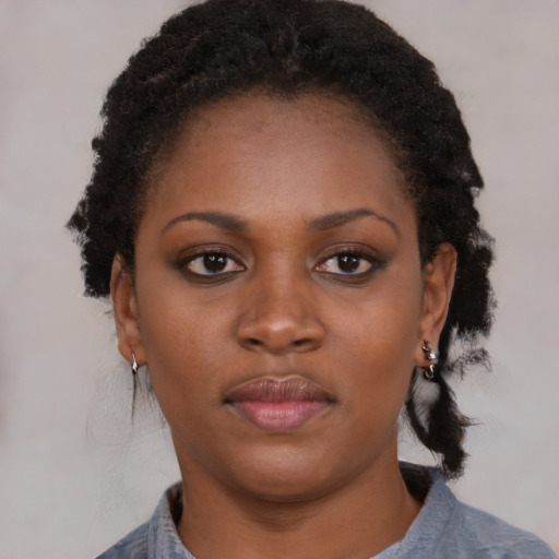 Neutral black young-adult female with short  black hair and brown eyes
