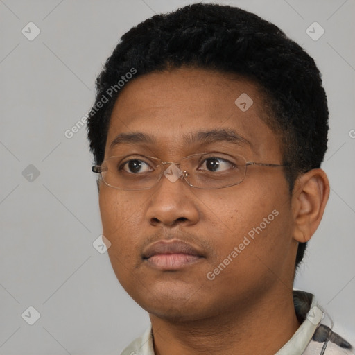 Neutral black young-adult male with short  black hair and brown eyes