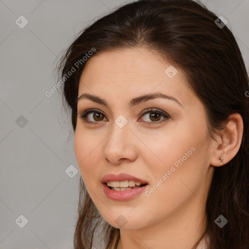 Joyful white young-adult female with long  brown hair and brown eyes