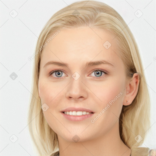 Joyful white young-adult female with long  brown hair and blue eyes