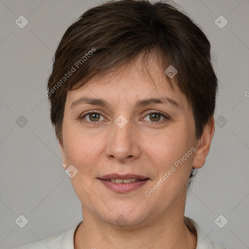 Joyful white adult female with short  brown hair and brown eyes