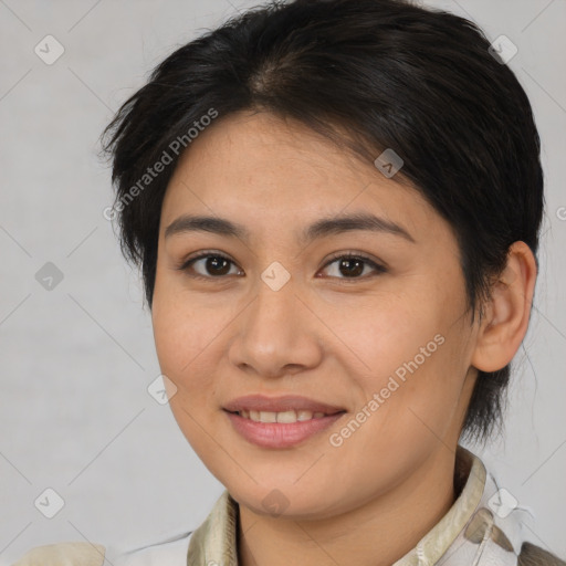 Joyful latino young-adult female with medium  brown hair and brown eyes