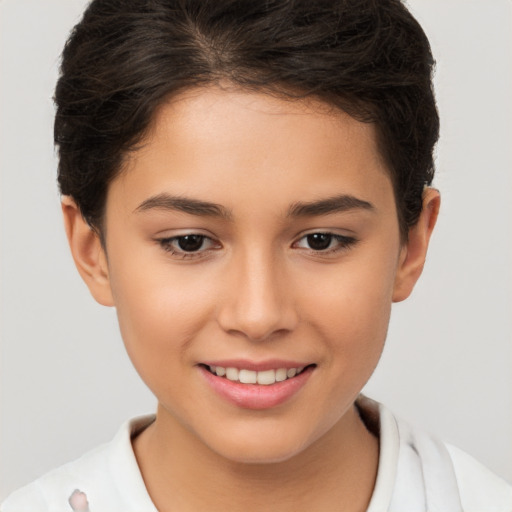 Joyful white child female with short  brown hair and brown eyes